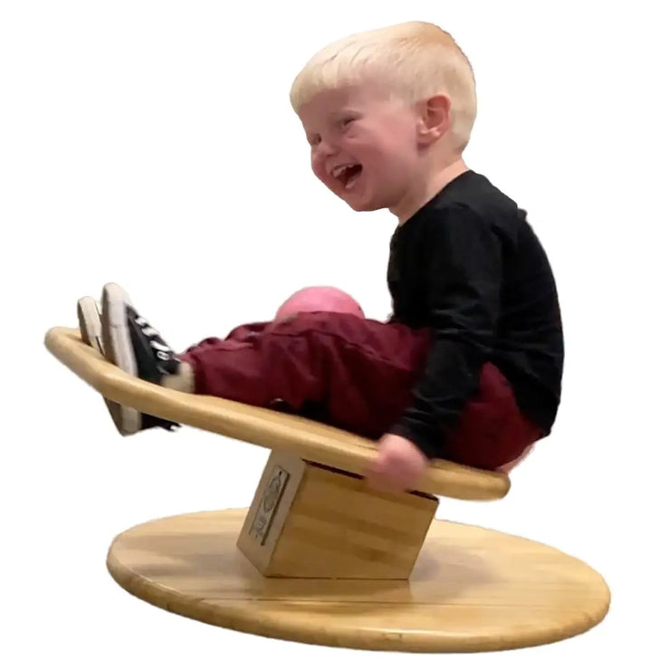 3 year old boy spinning on WhirlyGoRound.