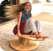 9 year old girl with long hair spinning on WhirlyGoRound.