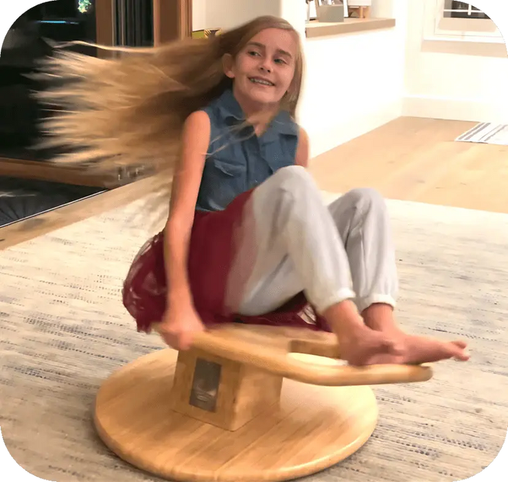 9 year old girl with long hair spinning on WhirlyGoRound.